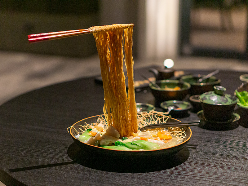 Flying Crispy Noodle with Seafood and Egg Gravy in Cantonese Style